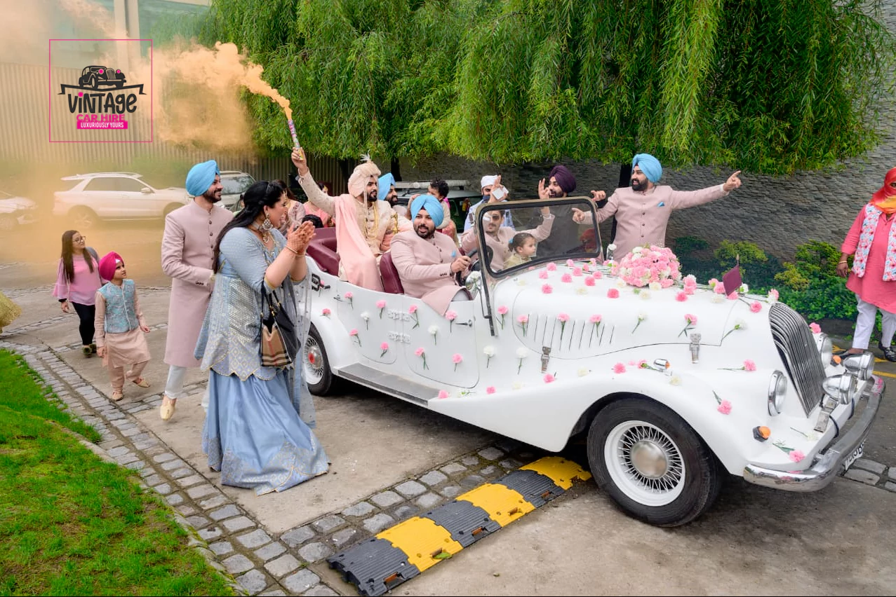 White Jaguar Vintage Car for Wedding Celebration.